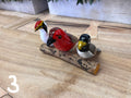 Wooden Birds Hanging - 3 on a Log